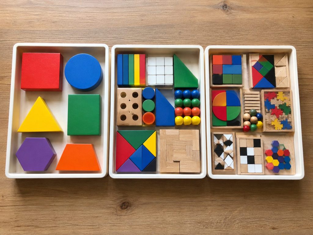 Logic toy sets arranged by difficulty level to match different childhood reasoning stages.